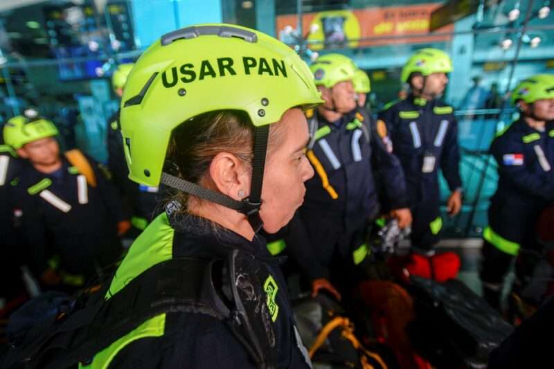 Rescuers from USAR-Panama get ready to embark on a flight to Turkey to participate in rescue efforts after the 7.8-magnitude earthquake that struck Turkey and Syria, at the Tocumen International airport in Panama City on February 10, 2023. (Photo by Román DIBULET / AFP)