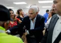 Panama's former president (2009-2014) Ricardo Martinelli greets followers after a press conference at the Realizando Metas party headquarters in Panama City, on June 27, 2023. Ex-president Martinelli is waiting for the sentence in the trial for the alleged crime of money laundering in the "New Business" case. Martinelli stands accused of having bought a majority share in the Editora Panama America publishing house in 2010, using illegally acquired state funds. (Photo by ROBERTO CISNEROS / AFP)